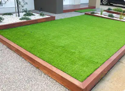 Family garden fitted with artificial grass in Leicester by Colourbank