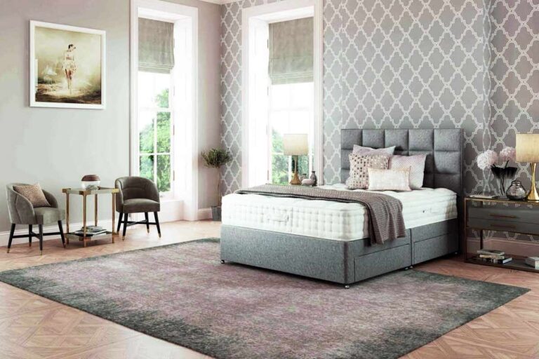 divan bed in room with wooden floor and rug